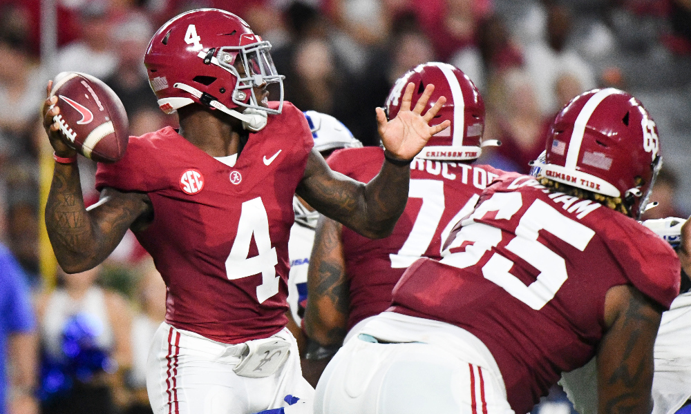 Alabama quarterback Jalen Milroe is protected by RT JC Latham