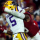 Alabama linebacker Dallas Turner delivers a hit on LSU quarterback Jayden Daniels
