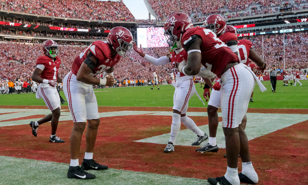 Alabama linebackers Deontae Lawson and Jihaad Campbell bow before LSU game