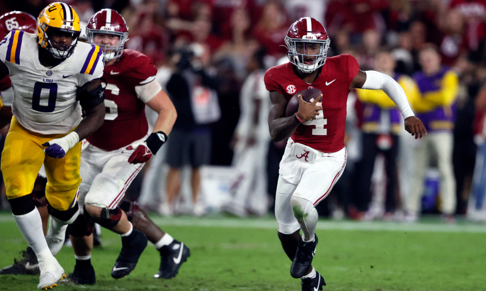 Alabama quarterback Jalen Milroe rushes to the outside against LSU