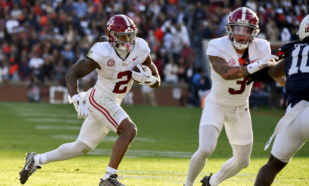 Alabama running back Jase McClellan carries the ball against Auburn in the Iron Bowl