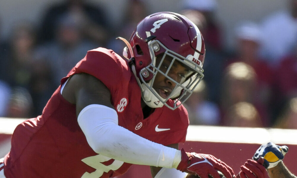 Alabama DB Kristian Story (No. 4) break in front of a pass for an interception against UTC.