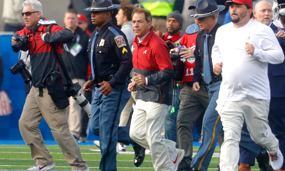 Alabama head coach Nick Saban jogs to midfield after defeating Kentucky