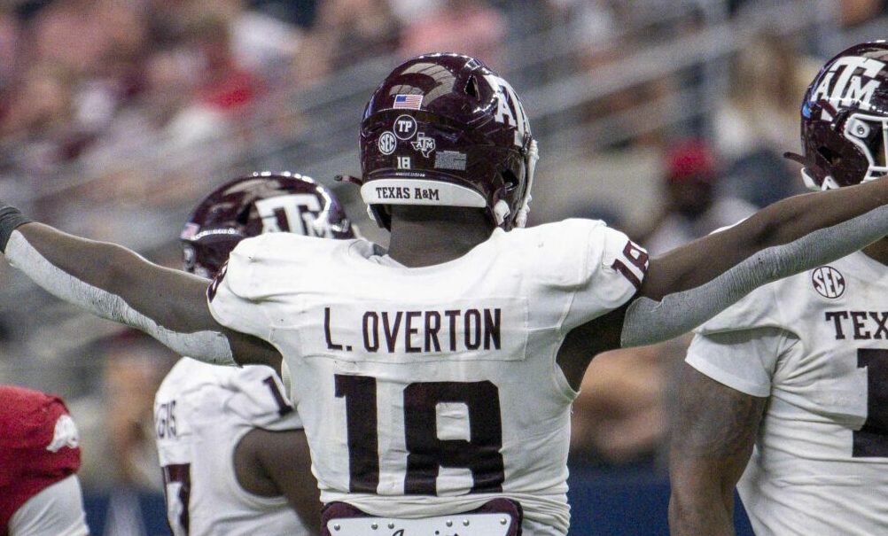Texas A&M DL LT Overton (#18) celebrates a huge play in 2023 matchup against Arkansas.