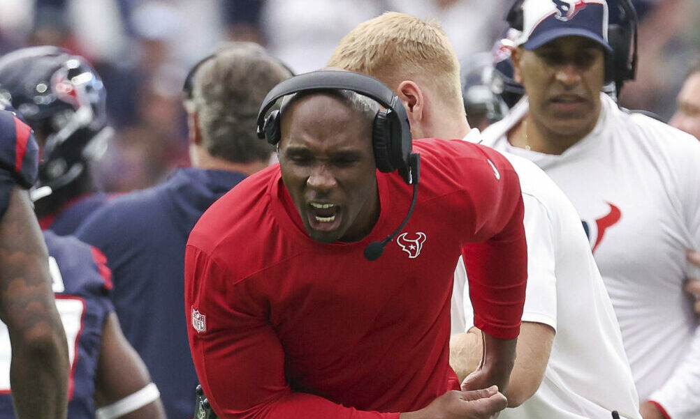 Houston Texans head coach DeMeco Ryans shows excitement on the sideline during 2023 game versus Titans.