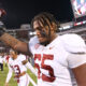 Alabama offensive lineman JC Latham walks off the field after defeating Mississippi State