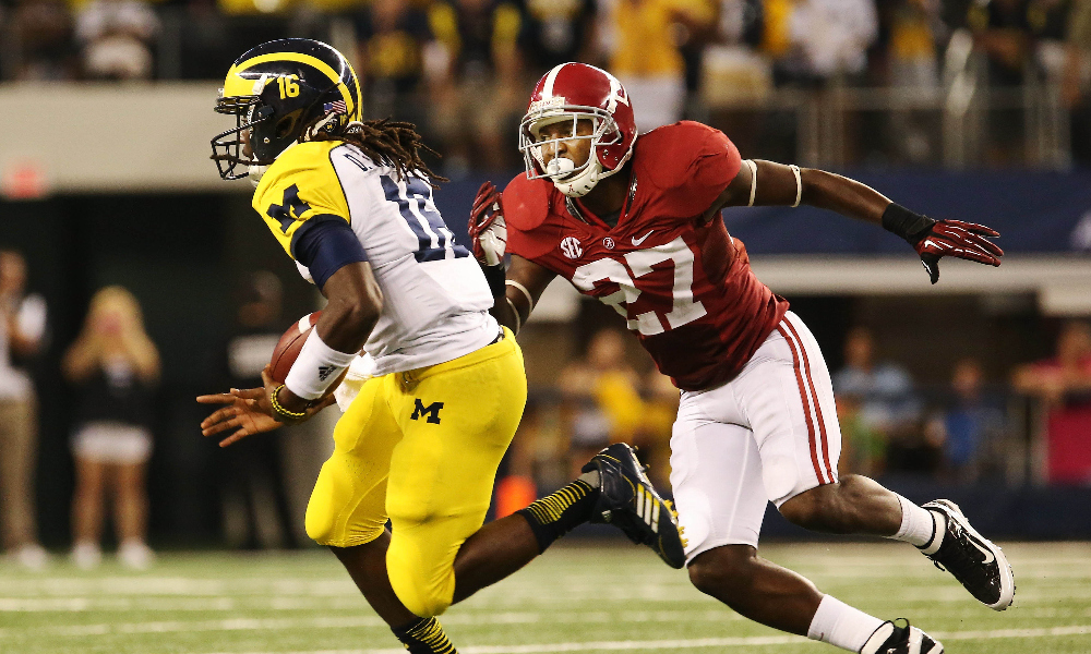 Alabama defensive back Nick Perry makes a tackle against Michigan