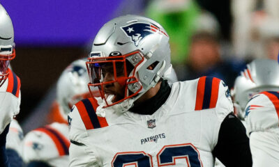 New England Patriots LB Anfernee Jennings (#33) celebrating with teammates after a play in 2023 season versus Broncos.