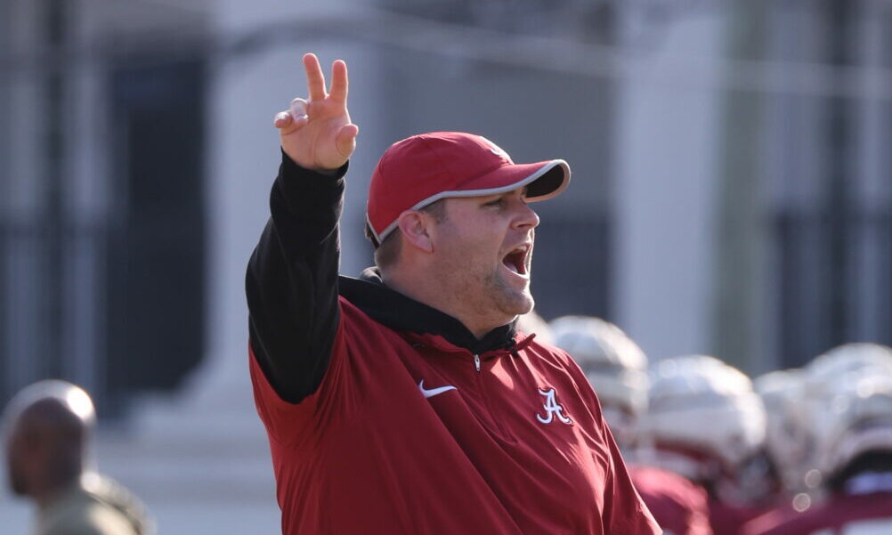Alabama DC Kane Wommack giving out signals in spring practice for the Crimson Tide.