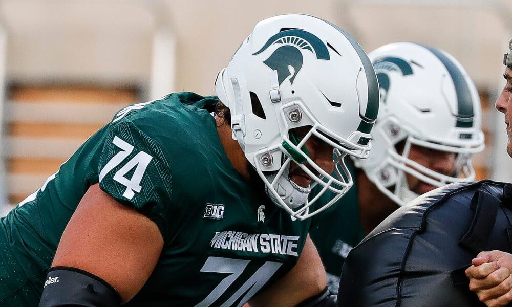 Michigan State OL Geno VanDeMark (#74) warms up before 2023 matchup against Western Michigan.