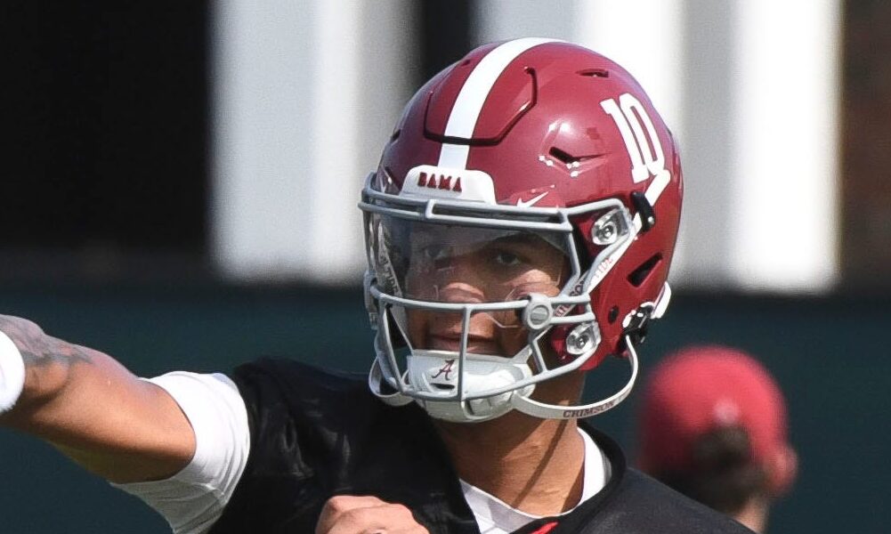 Alabama QB Austin Mack throws a pass in the Crimson Tide's first day of fall camp practice for 2024.