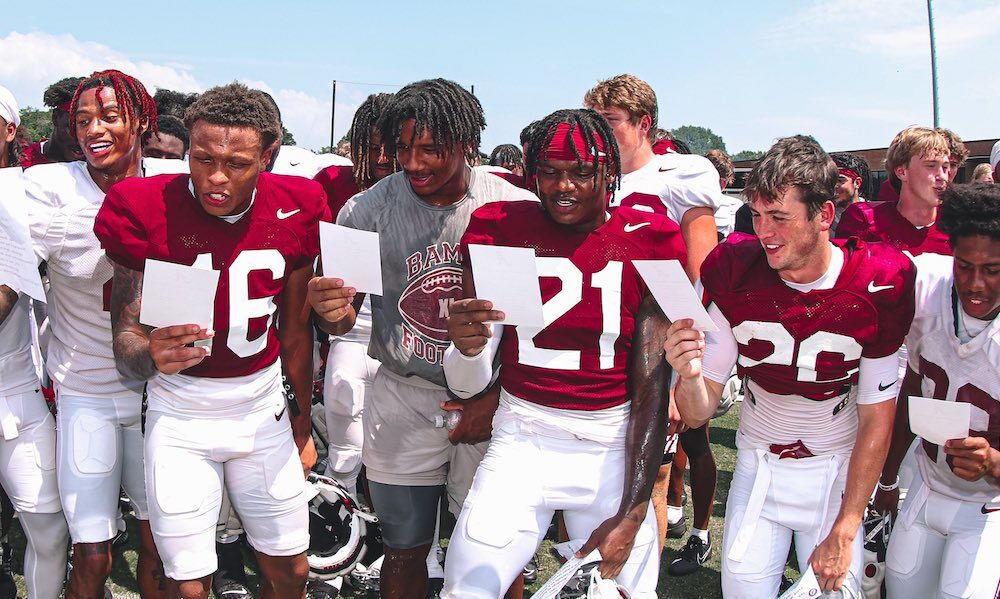 Alabama freshmen players learning the 'Yea Alabama' fight song after fall camp practice.