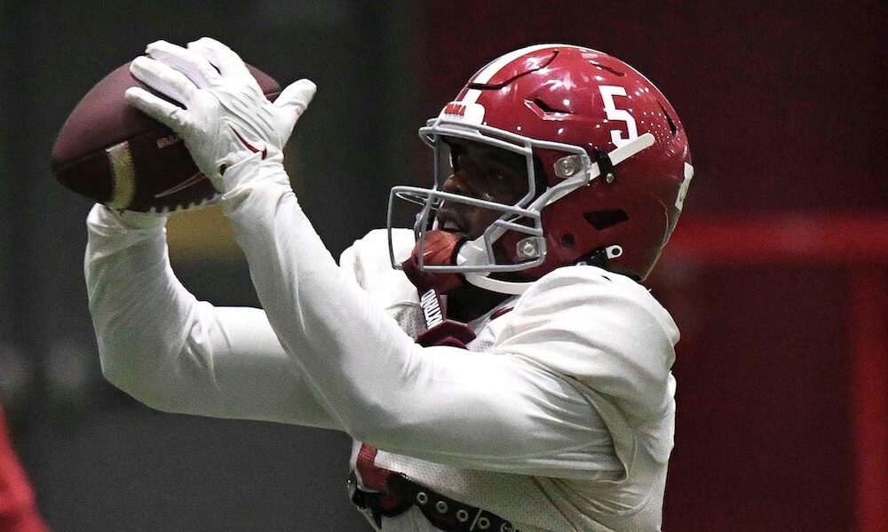 Alabama WR Germie Bernard (#5) catching passes during the Crimson Tide's 2024 spring practice.