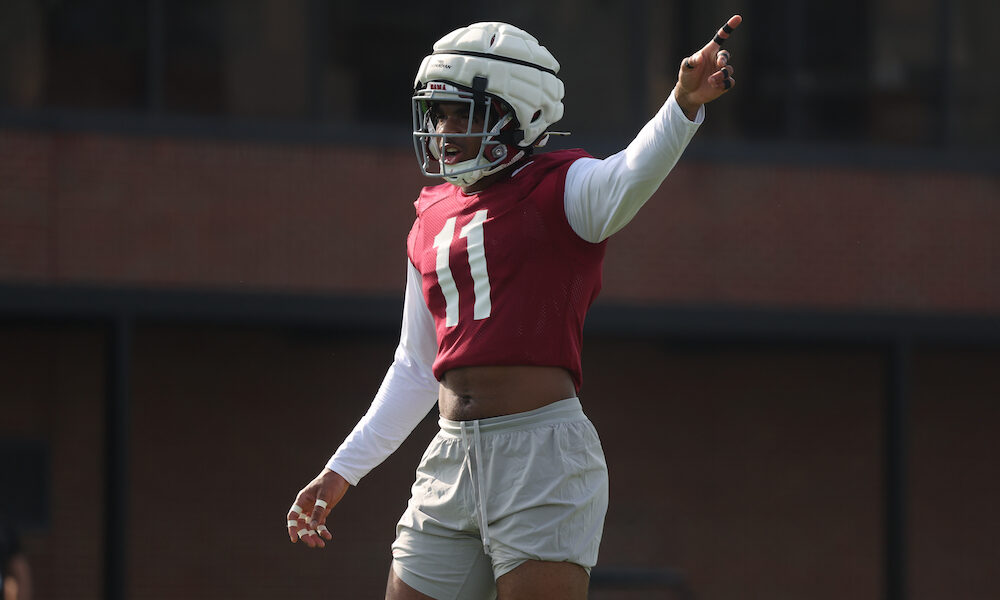 Alabama LB Jihaad Campbell (#11) directing signals at Crimson Tide fall camp.