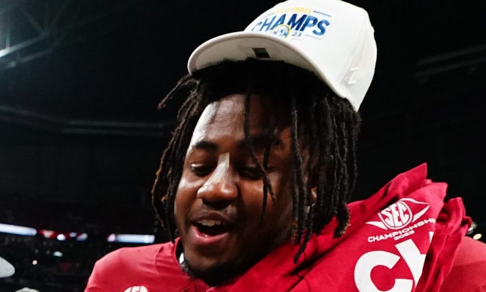 Alabama DL James Smith (No. 47) celebrates the 2023 SEC Championship victory over Georgia with Nick Saban.