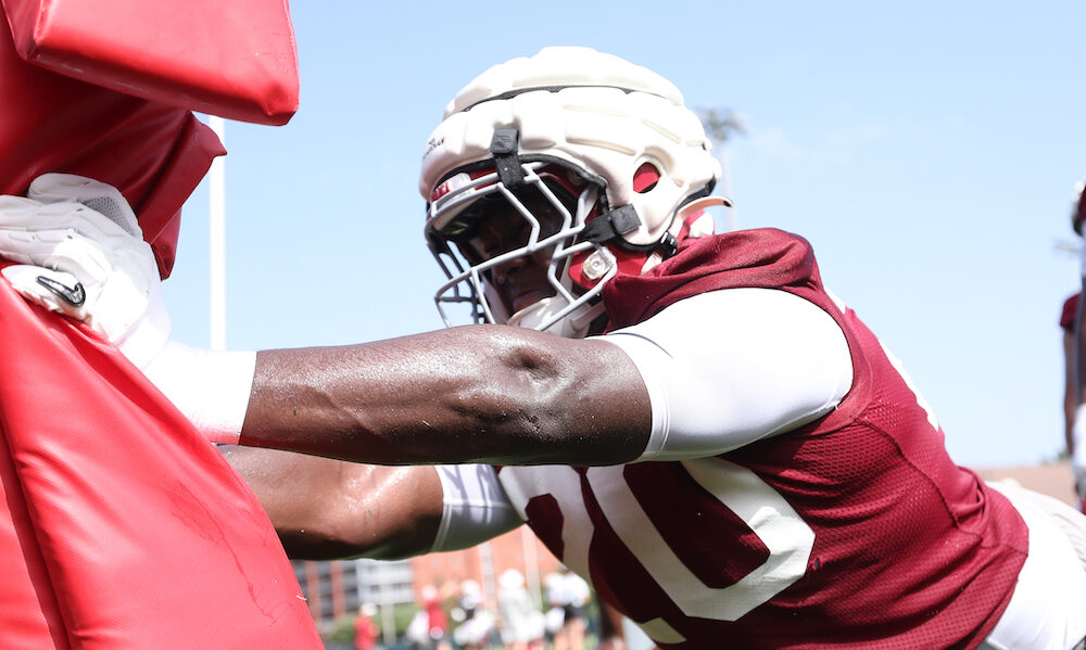 Alabama DL Jah-Marien Latham (#20) working the sled at Crimson Tide's fall camp practice.