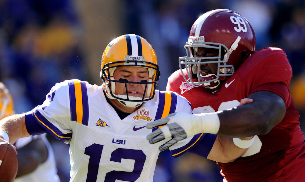 Alabama DL Josh Chapman (#99) sacks LSU's QB Jarrett Lee in 2010 matchup.