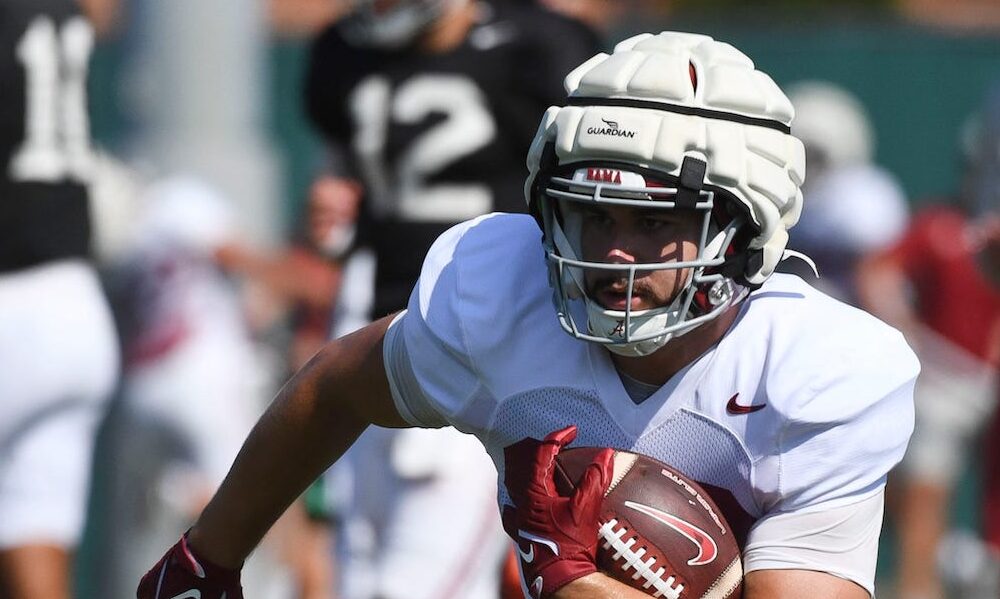 Alabama TE Josh Cuevas (#80) runs with the ball after making a catch during Crimson Tide's 2024 fall camp.