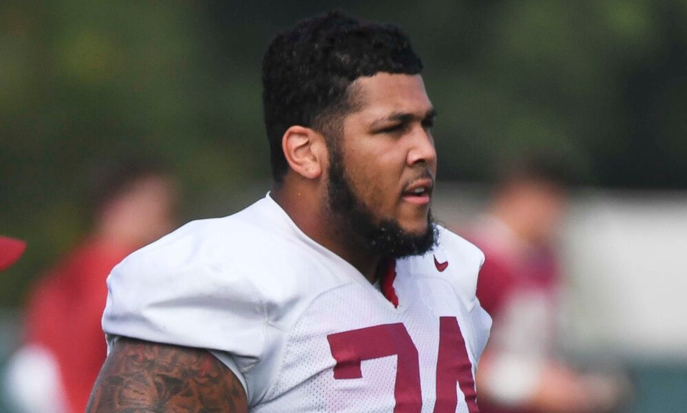 Alabama OT Kadyn Proctor (#74) looks on the practice field during Thursday's (Aug. 1) fall camp session.