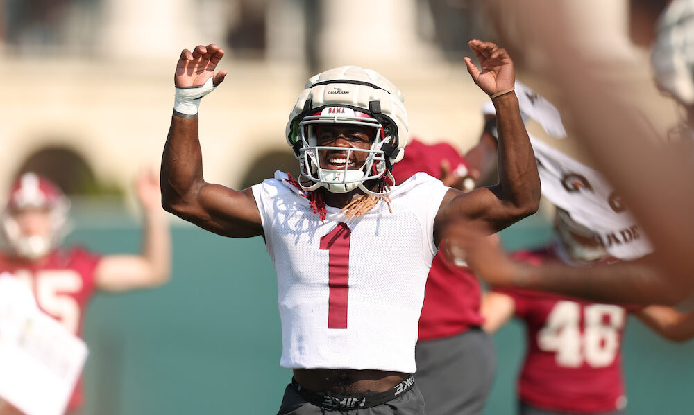 Alabama WR Kendrick Law (#1) exercising before starting 2024 Crimson Tide fall camp practice.