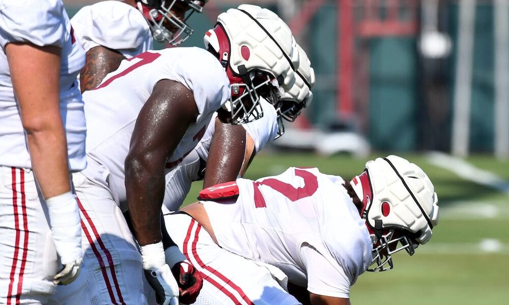 Alabama OL Parker Brailsford (#72) lined up at center preparing to snap the football at the Crimson Tide's 2024 fall camp practice.