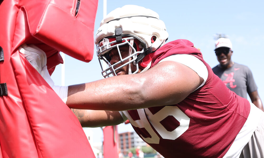 Alabama defensive lineman Tim Kennan III (#96) hitting the sled at Crimson Tide 2024 fall camp practice.