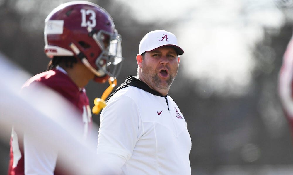 Alabama DC Kane Wommack communicating to the defense during 2024 Crimson Tide spring practice.