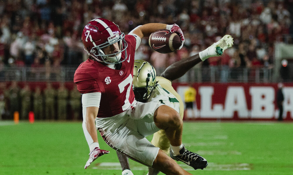 Alabama wide receiver Cole Adams (#7) makes the catch and gets tackled versus USF defender in 2024 matchup.