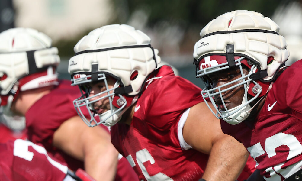 Alabama OL Tyler Booker (#52) at left tackle and Geno VanDeMark (#56) at left guard in Wednesday's practice.