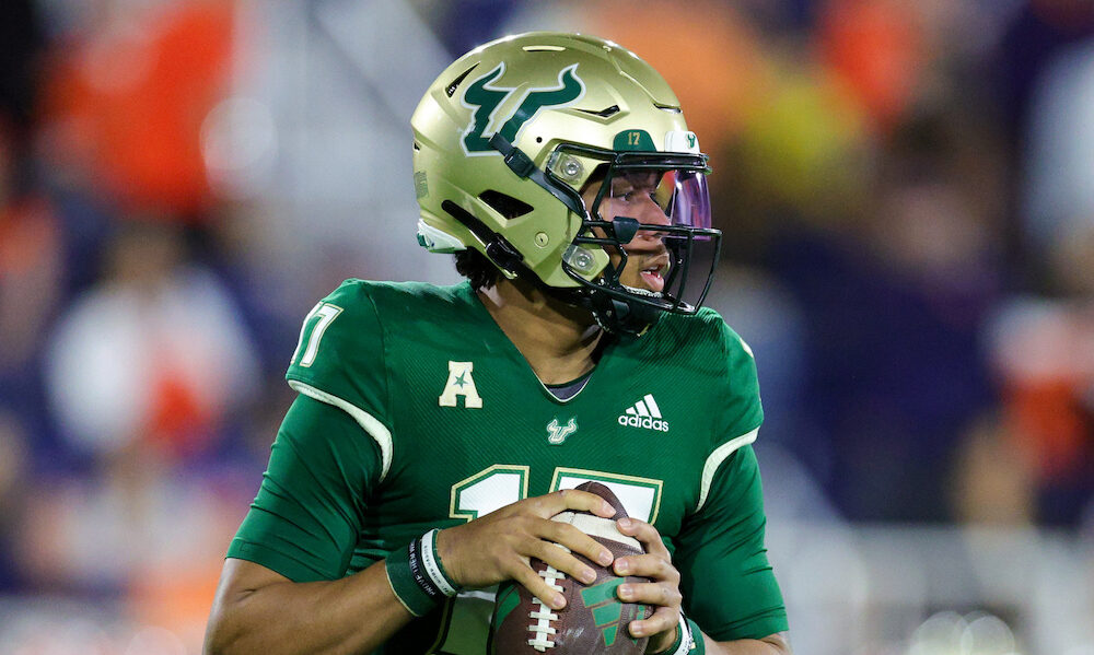 South Florida QB Byrum Brown (#17) attempts a pass in the Boca Raton Bowl game to end 2023 season.