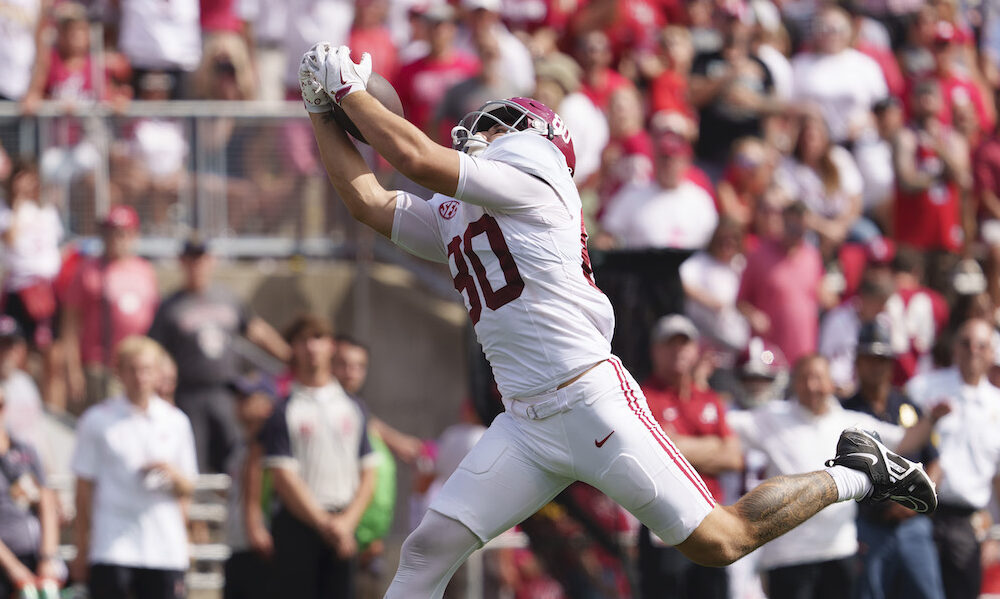 Alabama tight end Josh Cuevas (#80) catches a pass from Jalen Milroe for a touchdown in 2024 game against Wisconsin.