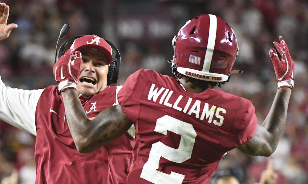 Alabama WR Ryan Williams (#2) celebrates a touchdown with an assistant coach in 2024 matchup against USF.