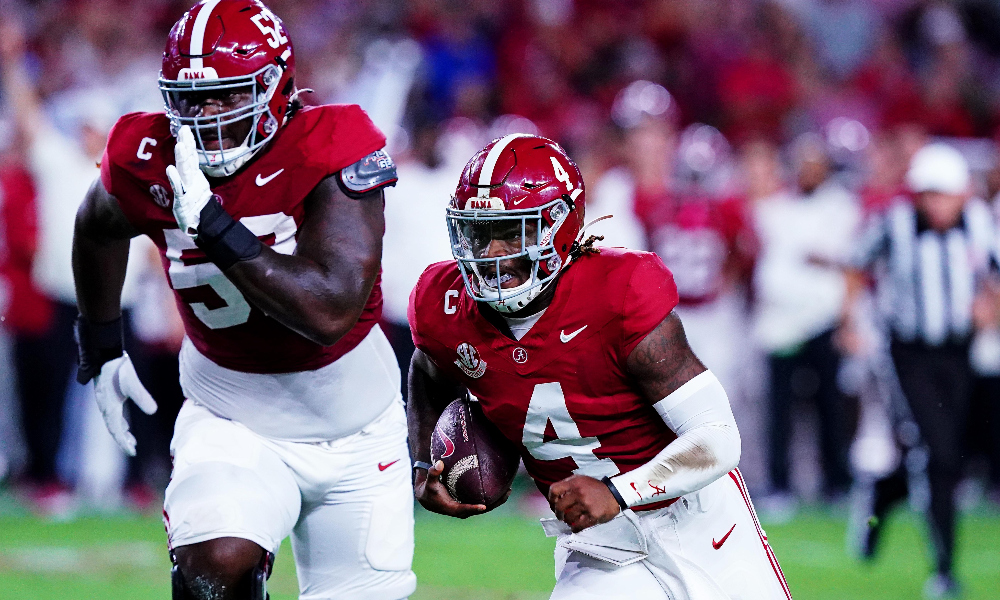 Alabama Crimson Tide quarterback Jalen Milroe (4) runs for a touchdown during the first quarter against the Georgia Bulldogs at Bryant-Denny Stadium.