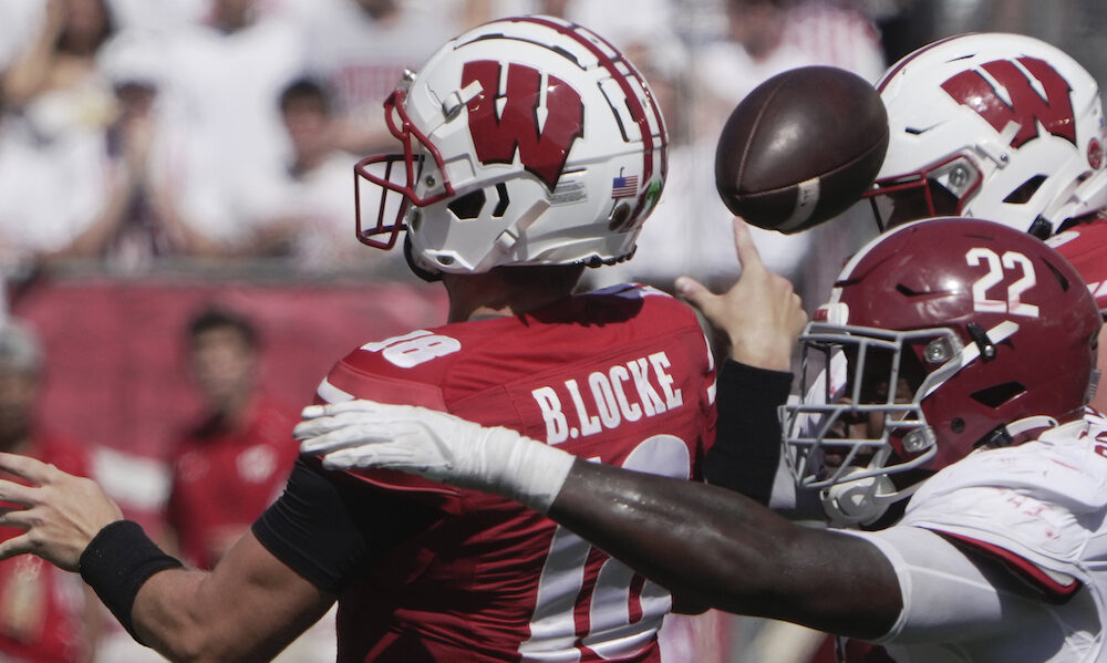 Alabama DL LT Overton (#22) forces an incomplete pass of Wisconsin's QB Braedyn Locke in 2024 matchup.