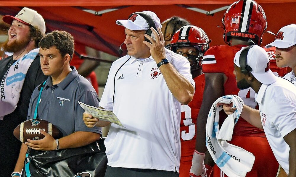 Jacksonville State HC Rich Rodriguez talking on a headset in Gamecocks first game of 2024 season.