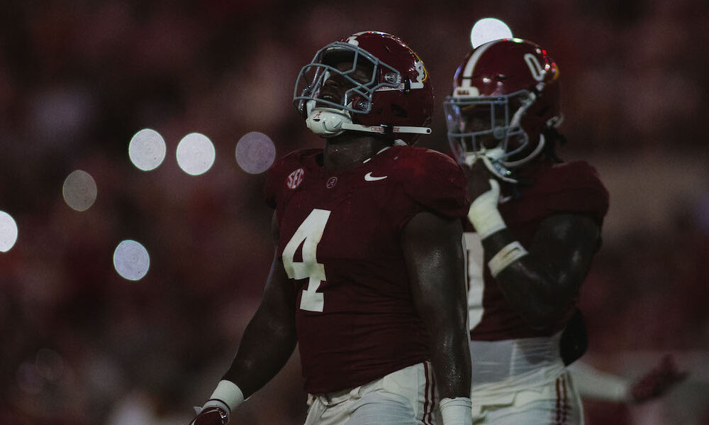 Alabama edge rusher Qua Russaw (#4) walks on the field at Bryant-Denny Stadium during matchup against WKU.