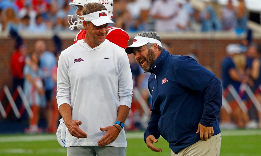 Mississippi Rebels head coach Lane Kiffin (left) shares a laugh with defensive coordinator Pete Golding (right) during warm ups prior to the game against the Georgia Southern Eagles at Vaught-Hemingway Stadium.