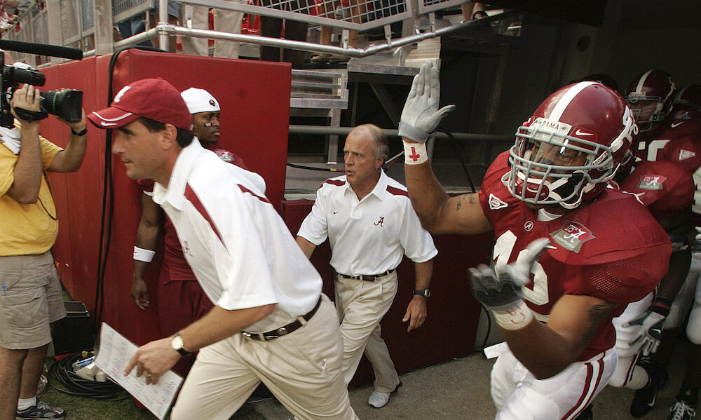 Alabama head coach Mike Shula leads the Crimson Tide on to the field for 2006 game versus Hawaii.