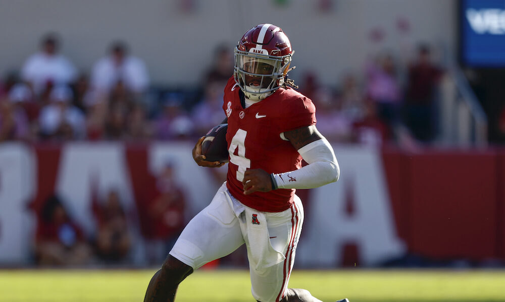 Oct 26, 2024; Tuscaloosa, Alabama, USA; Alabama Crimson Tide quarterback Jalen Milroe (4) carries the ball for a first down against the Missouri Tigers during the first half at Bryant-Denny Stadium.