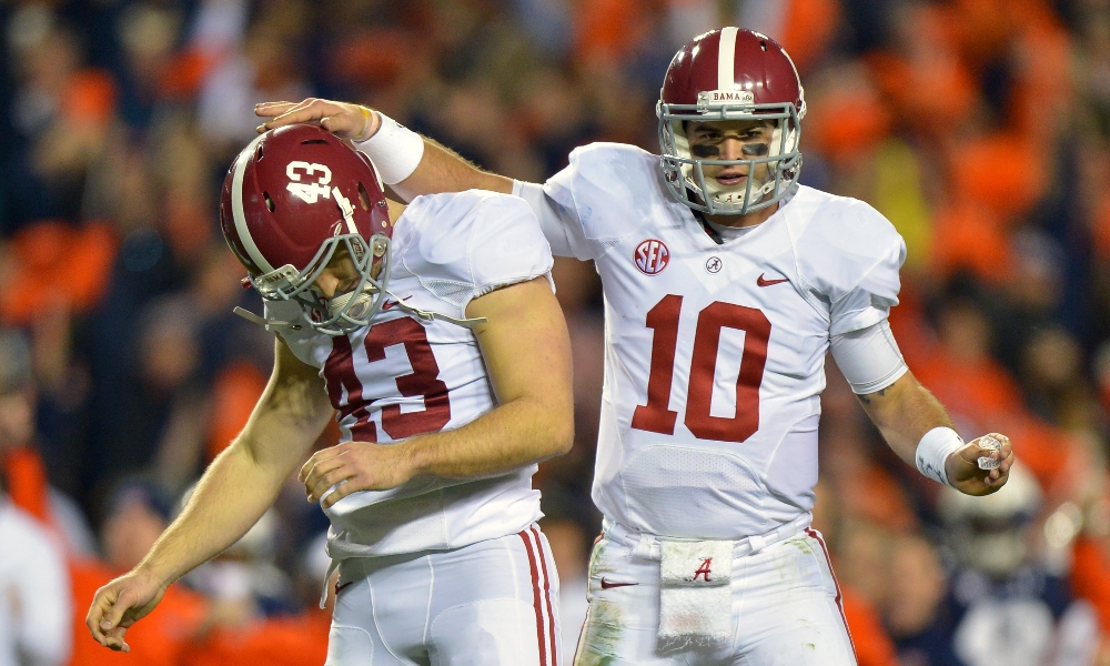 Nov 30, 2013; Auburn, AL, USA; Alabama Crimson Tide quarterback AJ McCarron (10) consoles Alabama Crimson Tide kicker Cade Foster (43) after a missed field goal during the fourth quarter at Jordan Hare Stadium.