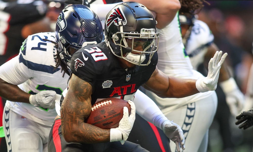 Oct 20, 2024; Atlanta, Georgia, USA; Atlanta Falcons running back Jase McClellan (30) runs the ball against the Seattle Seahawks in the fourth quarter at Mercedes-Benz Stadium.