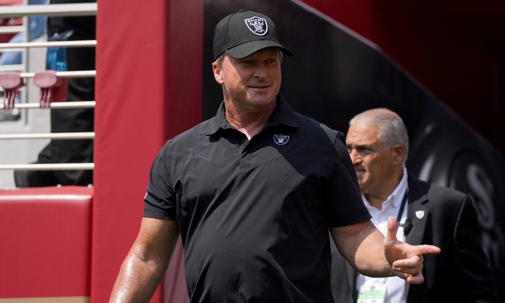 Former Las Vegas Raiders head coach Jon Gruden walks out of the tunnel