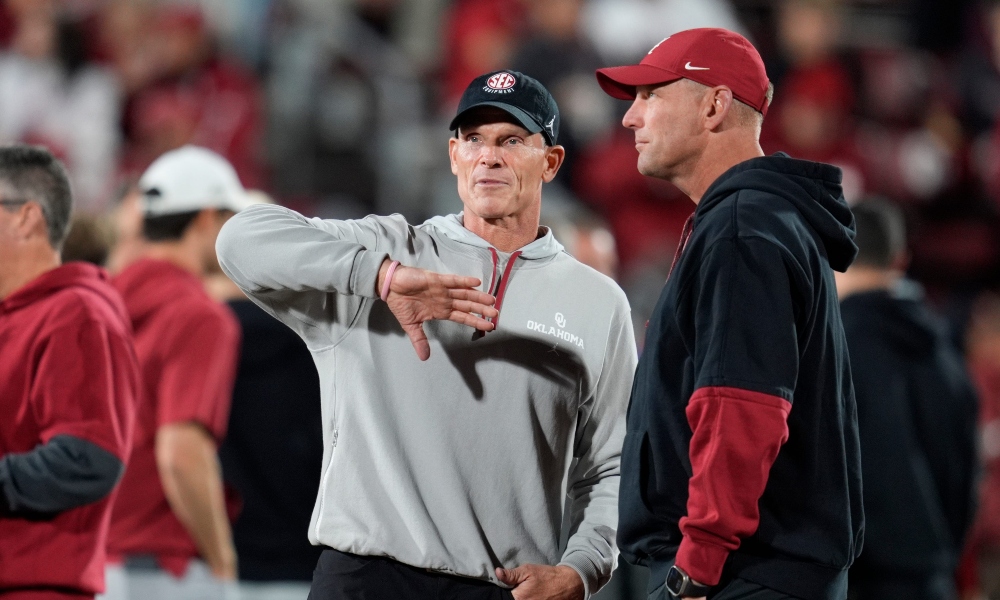 Oklahoma coach Brent Venables talks with Alabama coach Kalen DeBoer before a college football game between the University of Oklahoma Sooners (OU) and the Alabama Crimson Tide at Gaylord Family - Oklahoma Memorial Stadium in Norman, Okla., Saturday, Nov. 23, 2024.