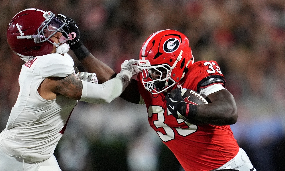 Sep 27, 2025; Athens, Georgia, USA; Georgia Bulldogs running back Chauncey Bowens (33) runs against Alabama Crimson Tide defensive back Domani Jackson (1) in the second half at Sanford Stadium.