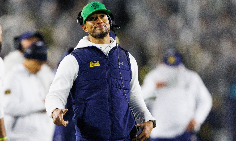 Notre Dame head coach Marcus Freeman looks at the scoreboard