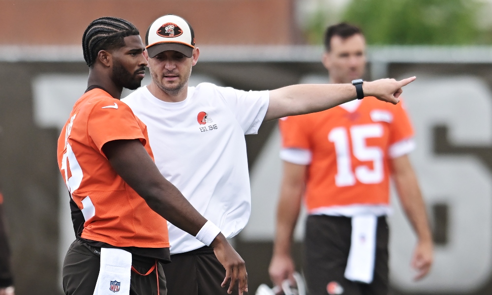 Cleveland Browns offensive coordinator Tommy Rees coaches quarterback Shedeur Sanders