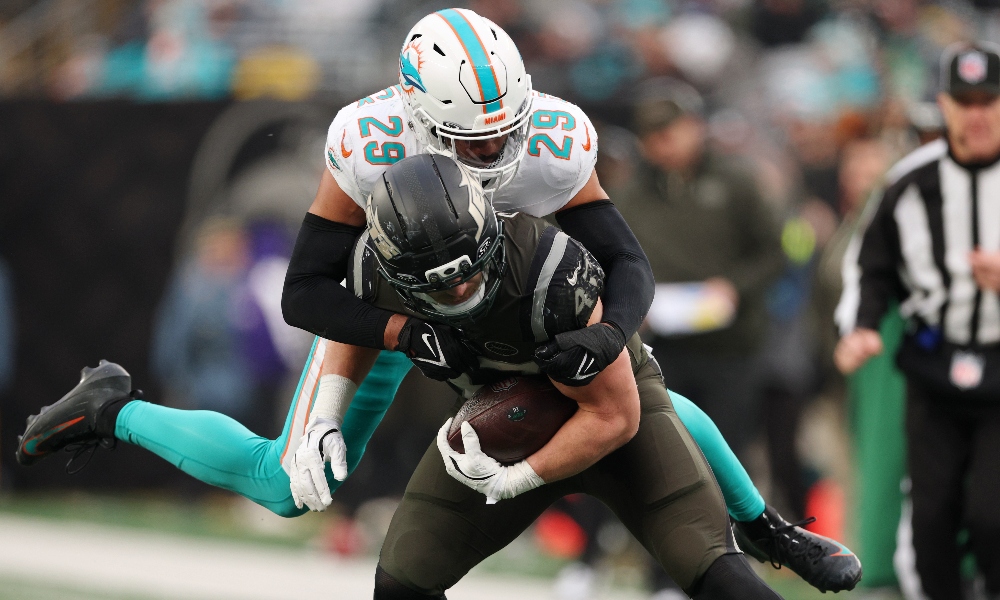 Dec 7, 2025; East Rutherford, New Jersey, USA; Miami Dolphins safety Minkah Fitzpatrick (29) tackles New York Jets fullback Andrew Beck (47) during the second half at MetLife Stadium.