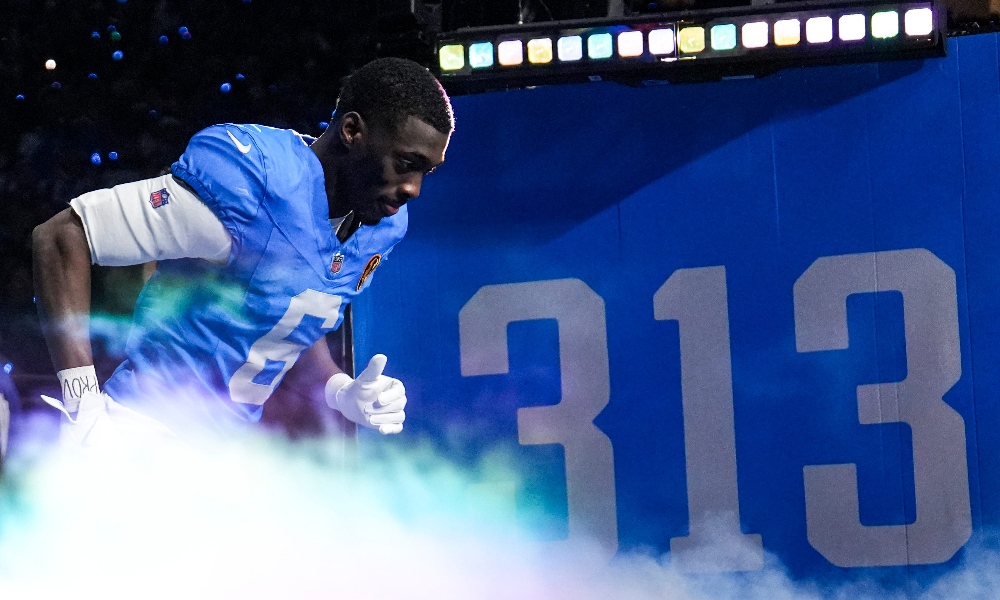 Detroit Lions defensive back Terrion Arnold runs out of the tunnel