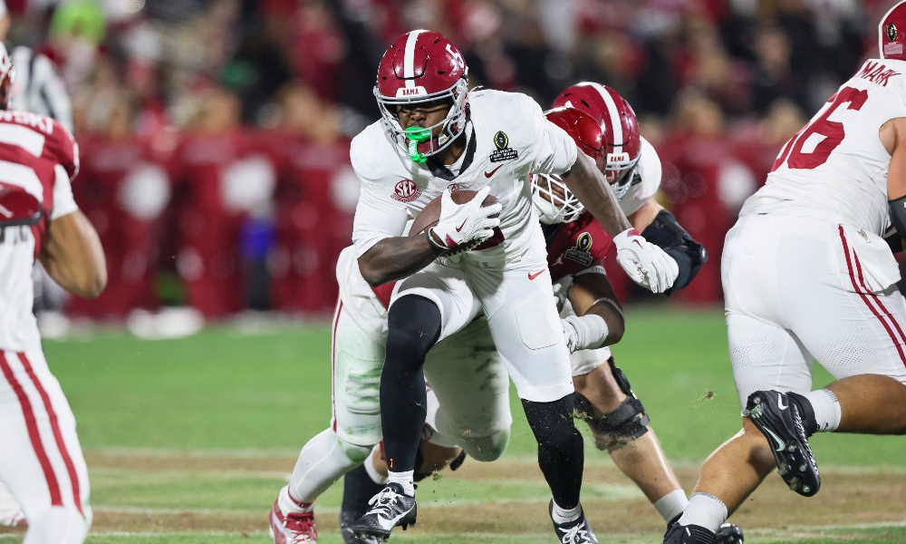 Dec 19, 2025; Norman, OK, USA; Alabama Crimson Tide wide receiver Germie Bernard (5) runs the ball in the second half against the Oklahoma Sooners at Gaylord Family OK Memorial Stadium.