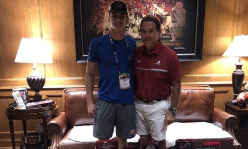 Ty Simpson takes picture with Nick Saban during visit